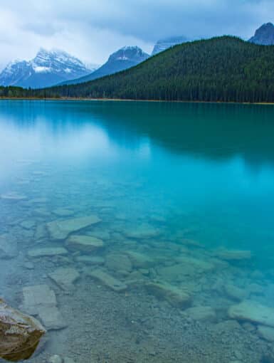 Reflection of the mountains off Waterfowl Lakes in Banff National Park Canada